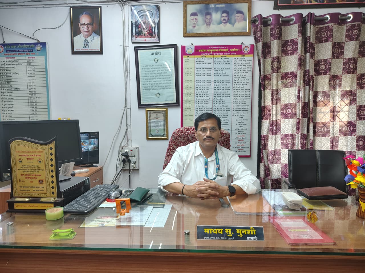 School Principal at desk